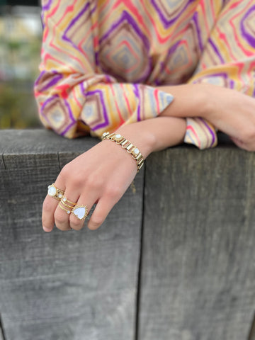 Bague dorée coeur piquant blanc